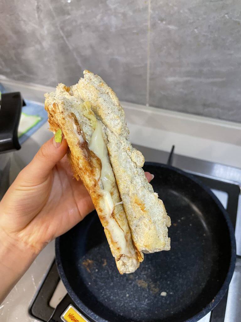 Close up of high protein, low calorie bread made with egg whites, psyllium husk, cream of tartar and protein powder. Grilled on the stove with cheese, lightly toasted.